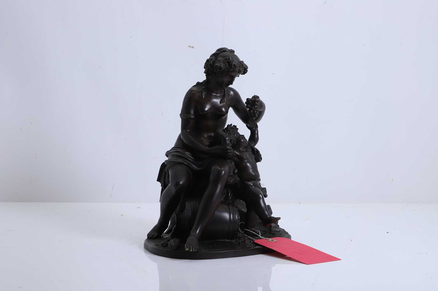 Lot 256 - A French bronze figural group of a bacchante and putto