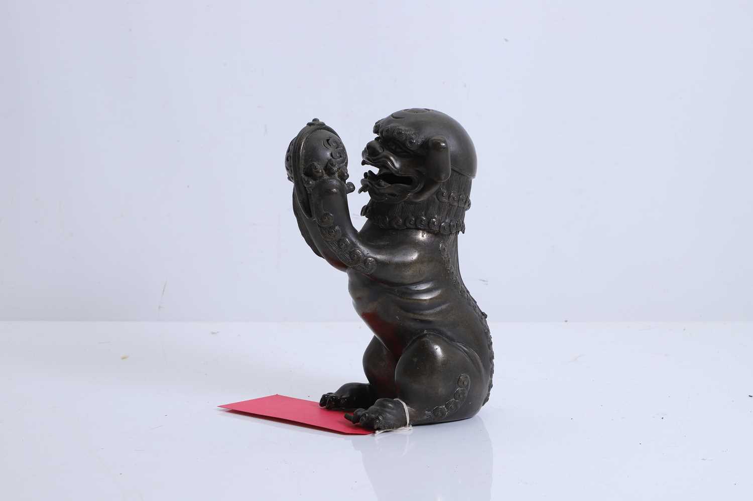 Lot 62 - A Chinese bronze Buddhist lion (shishi) incense burner