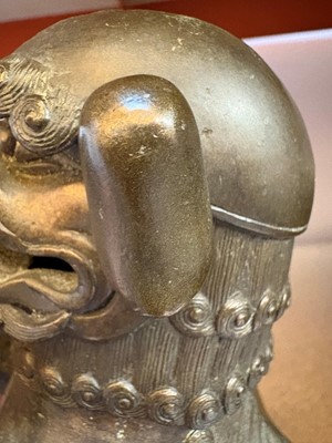 Lot 62 - A Chinese bronze Buddhist lion (shishi) incense burner