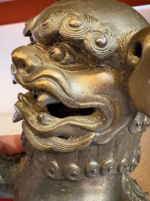 Lot 62 - A Chinese bronze Buddhist lion (shishi) incense burner