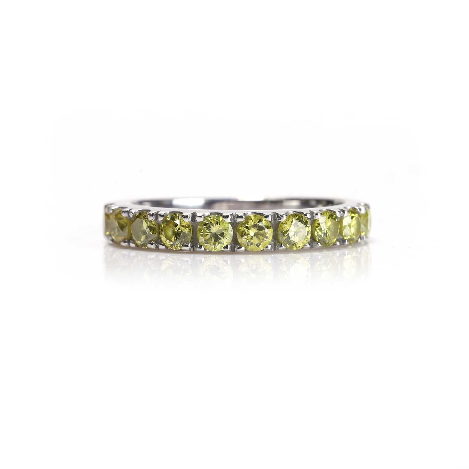 Lot 62 - A fancy coloured diamond half eternity ring