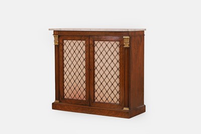 Lot 68 - A George IV-style walnut and parcel-gilt pier cabinet by Gillows