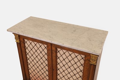Lot 68 - A George IV-style walnut and parcel-gilt pier cabinet by Gillows