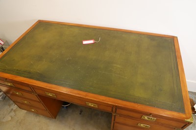Lot 504 - A large mahogany campaign-style desk and matching chair