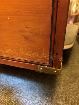 Lot 504 - A large mahogany campaign-style desk and matching chair