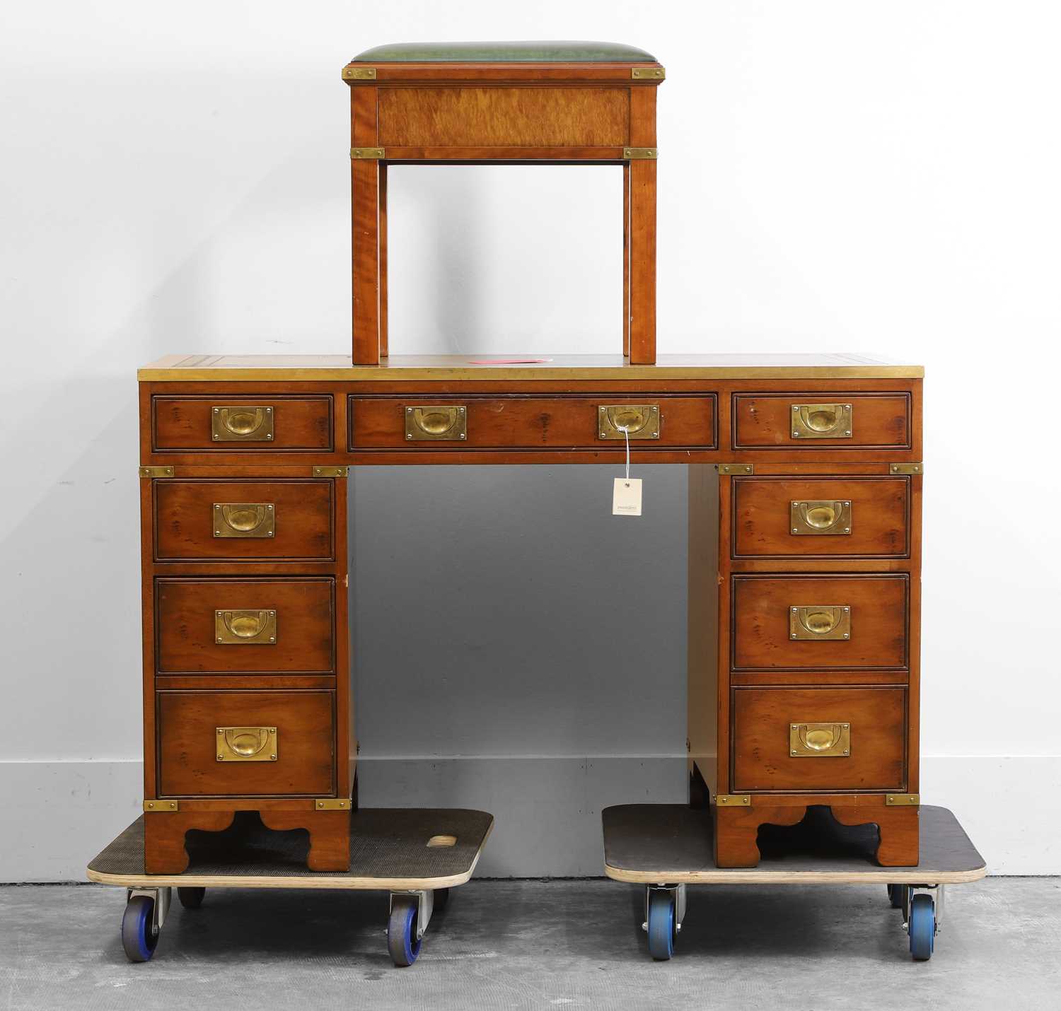 Lot 505 - A mahogany campaign style desk and matching stool