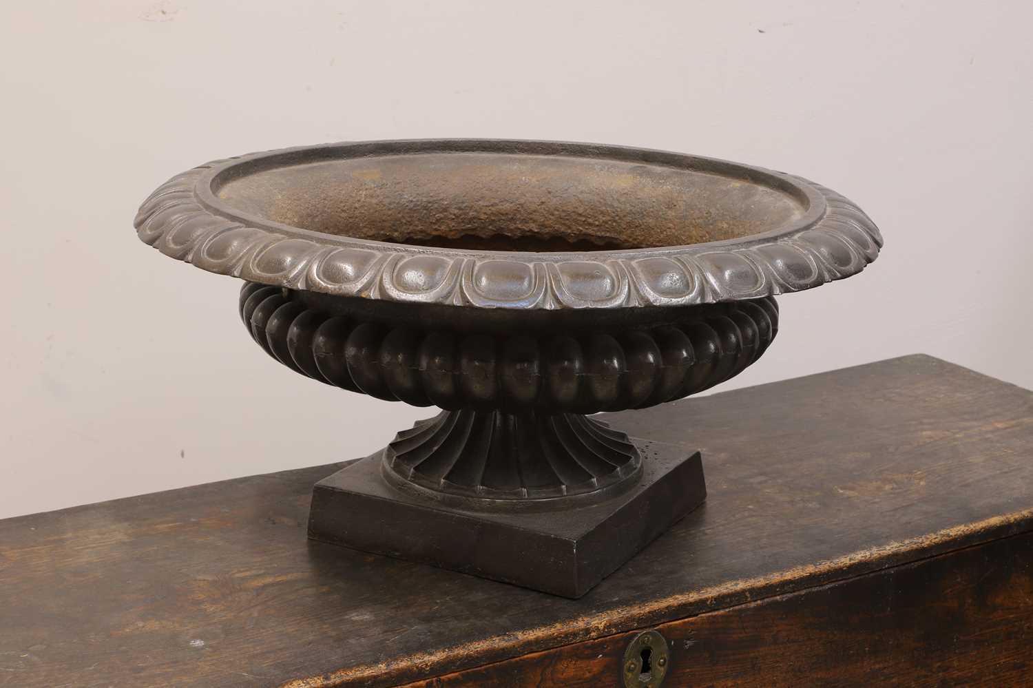 Lot 551 - A steel pedestal urn