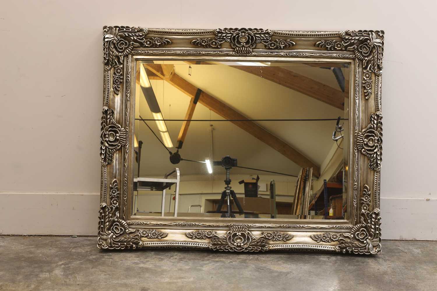 Lot 493 - A large ornate framed mirror