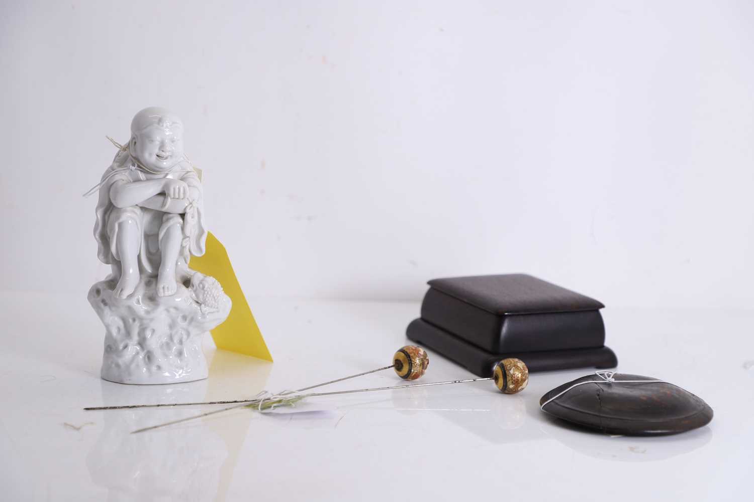 Lot 52 - A Chinese blanc de Chine figure of Liu Hai