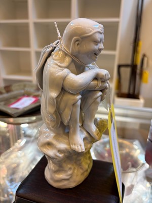 Lot 52 - A Chinese blanc de Chine figure of Liu Hai