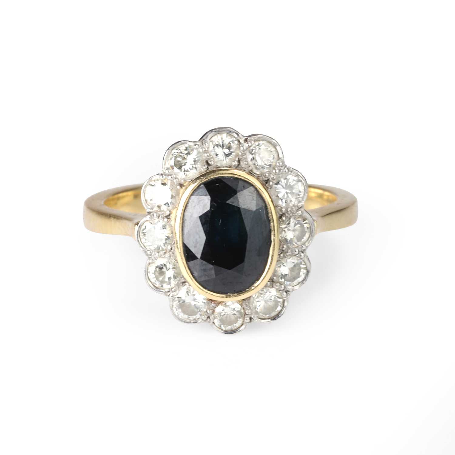 Lot 53 - An 18ct gold sapphire and diamond cluster ring