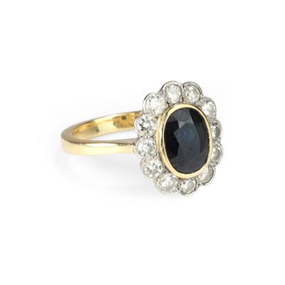 Lot 53 - An 18ct gold sapphire and diamond cluster ring