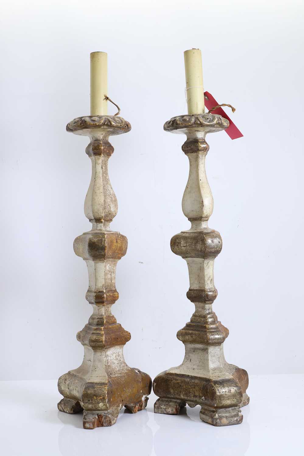 Lot 475 - A pair of Continental gilt carved wood alter candlesticks