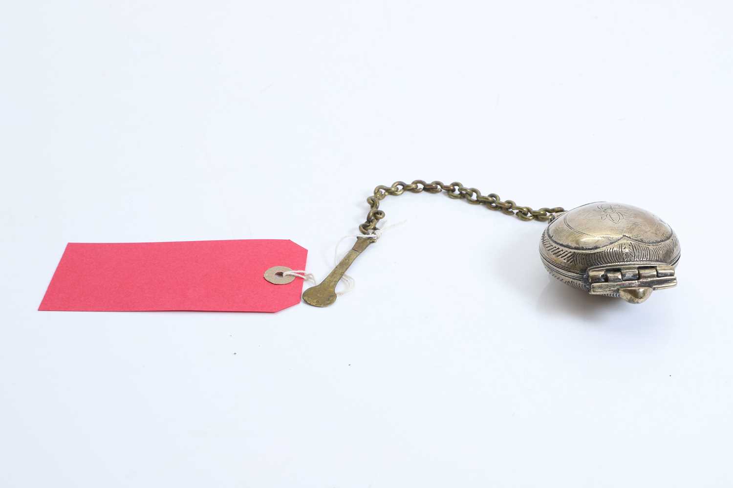 Lot 65 - A white metal betel lime box or chuna dani