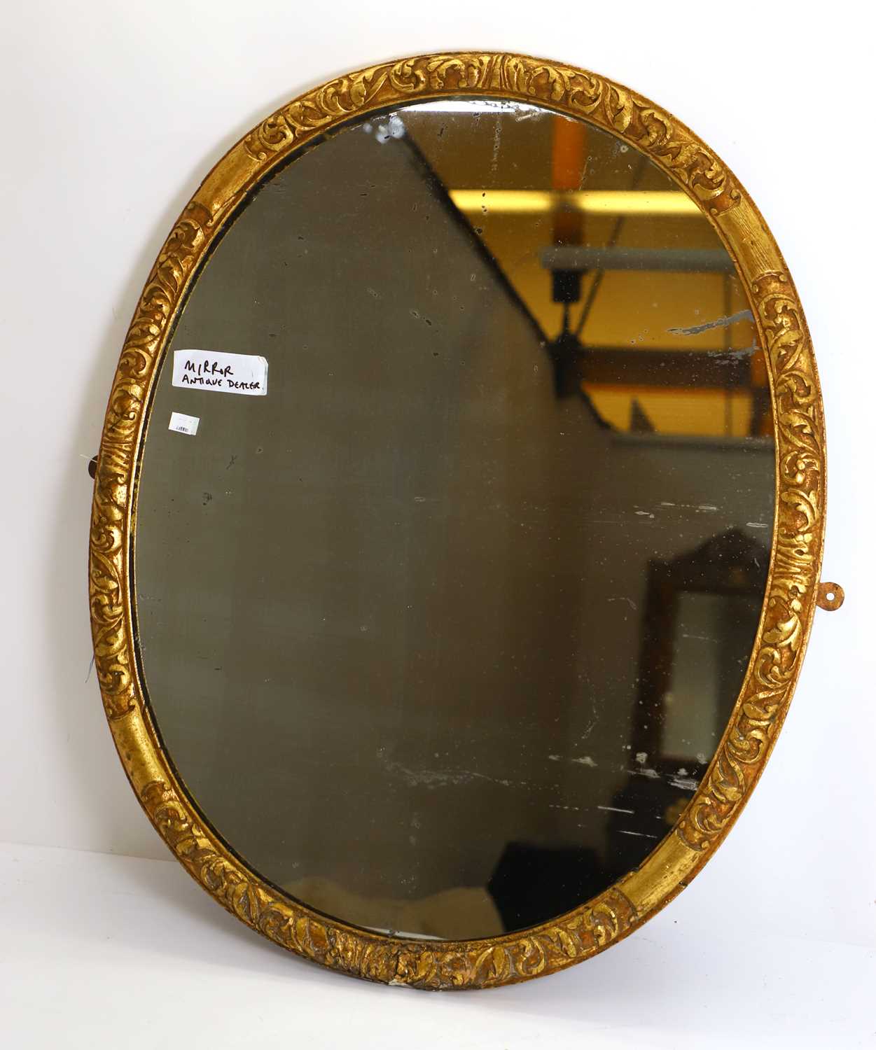 Lot 494 - A George II style giltwood oval wall mirror