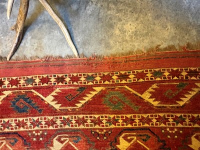 Lot 422 - A large Tekke type carpet