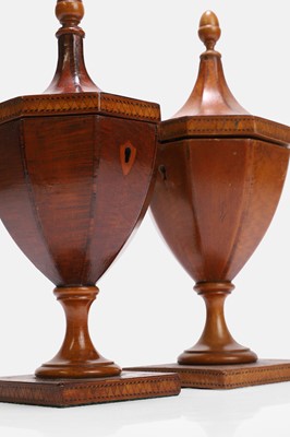 Lot 43 - A near pair of George III yew and satinwood urn tea caddies