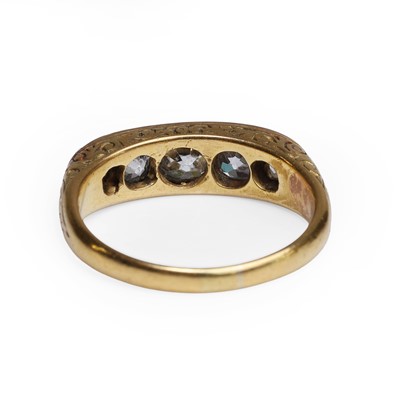 Lot 32 - A diamond five stone carved half hoop ring