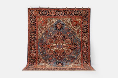 Lot 380 - A wool carpet of Persian Heriz design