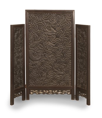 Lot 68 - A Chinese carved wood folding screen