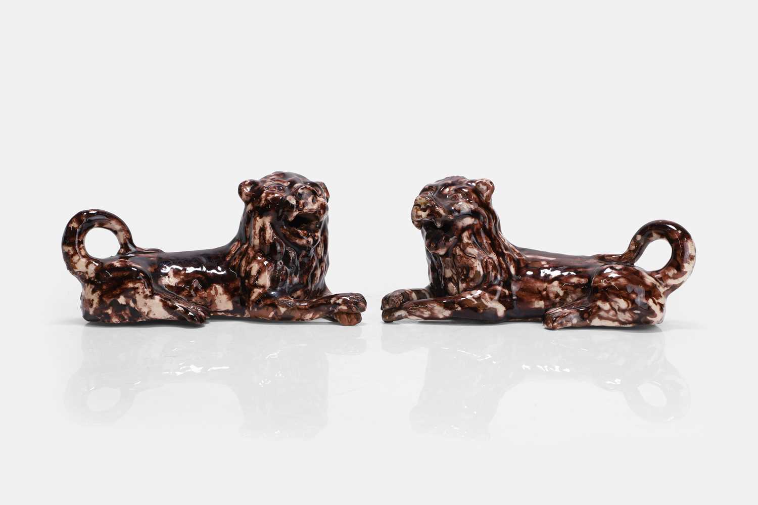 Lot 390 - A pair of Whieldon-type pottery lions
