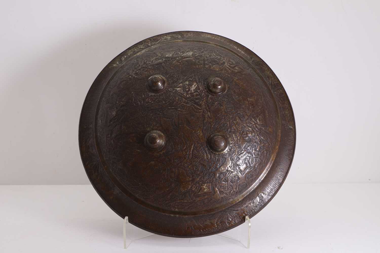 Lot 86 - An Indian copper-alloy decorative dhal shield