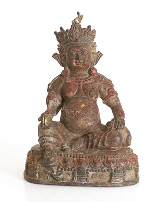 Lot 76 - A Tibetan polychrome painted cast-metal figure of Jambhala