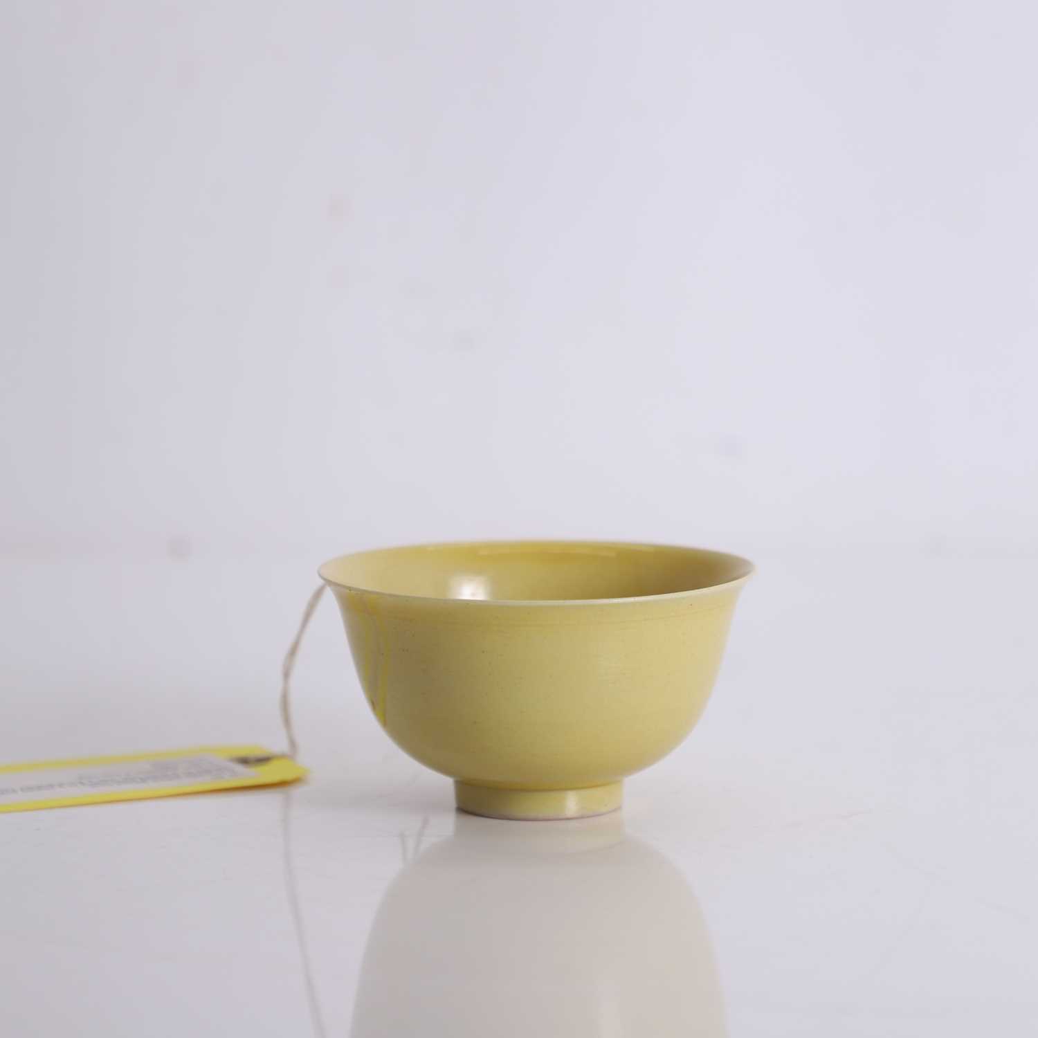 Lot 60 - A Chinese yellow glazed bowl
