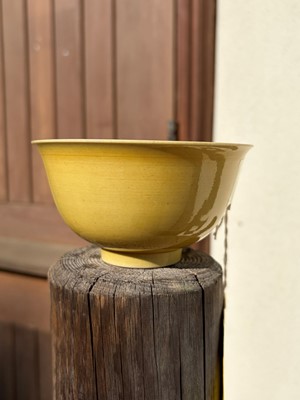 Lot 60 - A Chinese yellow glazed bowl