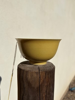 Lot 60 - A Chinese yellow glazed bowl