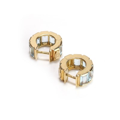 Lot 89 - A pair of 18ct gold blue topaz 'huggie' earrings