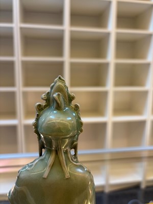 Lot 51 - A celadon glazed figure of Guanyin