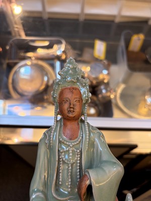 Lot 51 - A celadon glazed figure of Guanyin