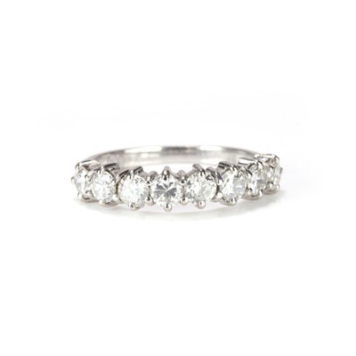 Lot 106 - An 18ct white gold diamond half eternity