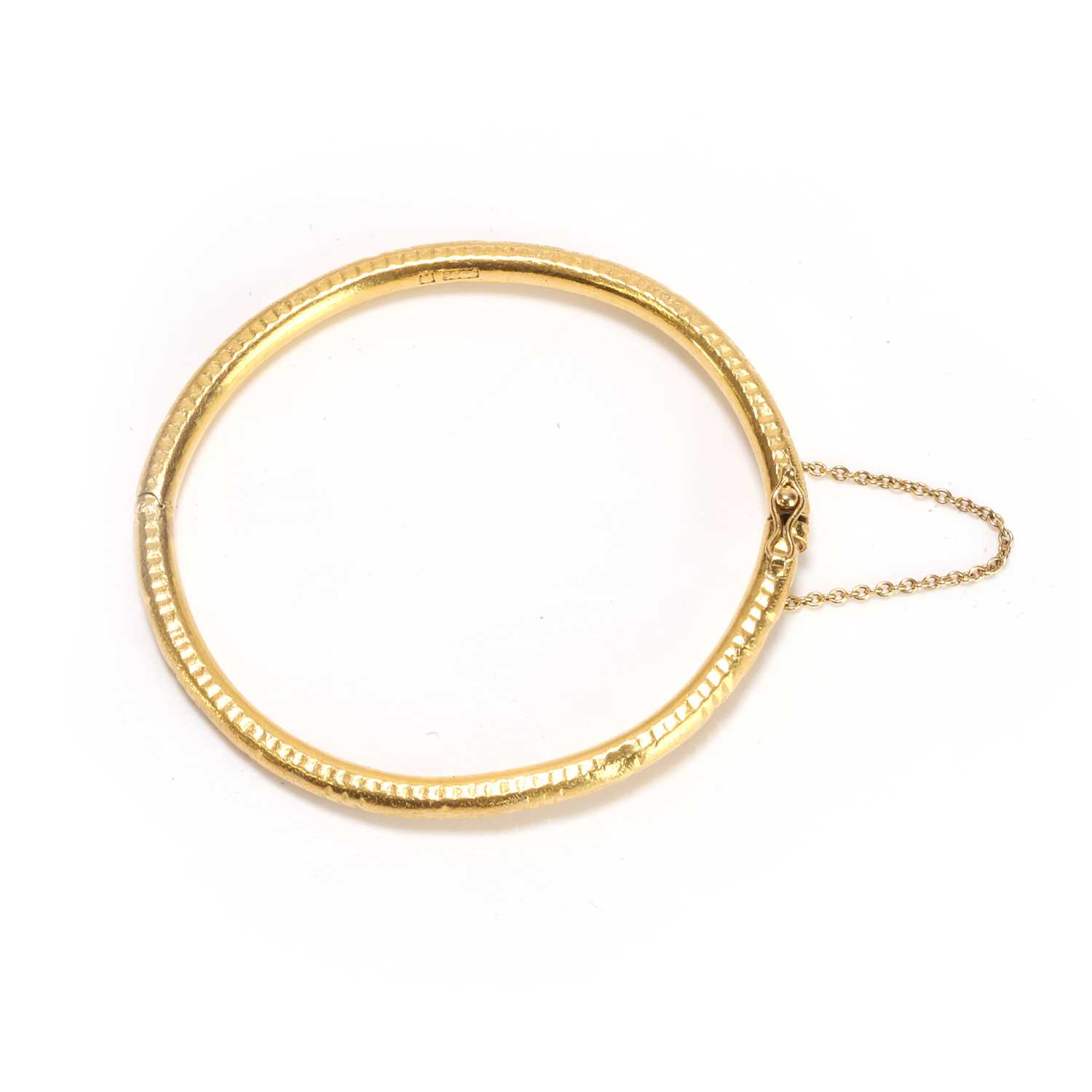 Lot 60 - An engraved bangle