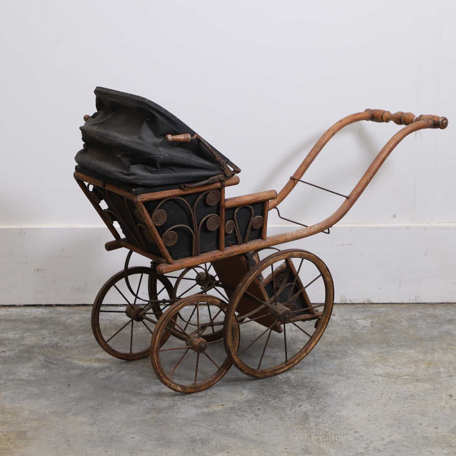 Lot 301 - A Victorian wood four-wheel perambulator