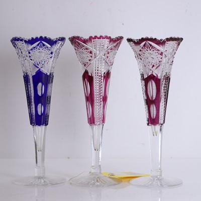 Lot 154 - Three Bohemian ruby and blue cased glass vases