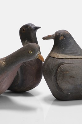 Lot 125 - A flight of three wooden decoy pigeons