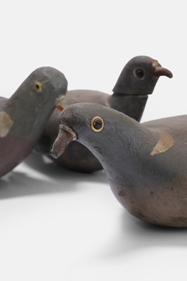 Lot 128 - A flight of three wooden decoy pigeons