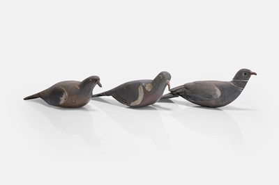 Lot 128 - A flight of three wooden decoy pigeons