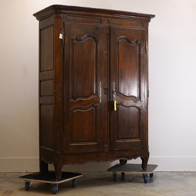 Lot 513 - A French provincial walnut armoire