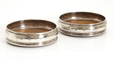 Lot 7 - A pair of silver wine coasters