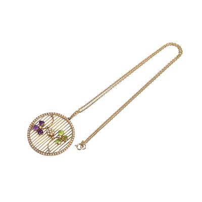 Lot 16 - An Edwardian amethyst, peridot and split pearl pendant on chain