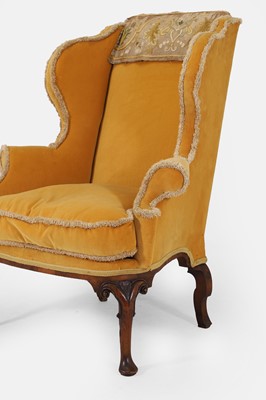 Lot 216 - A George I upholstered wing armchair