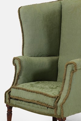 Lot 241 - A Regency upholstered wing armchair