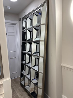 Lot 499 - A large silvered rectangular wall mirror by OKA