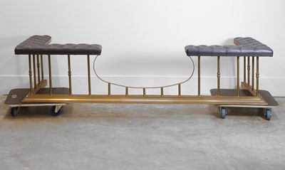 Lot 534 - A brass framed and upholstered club fender