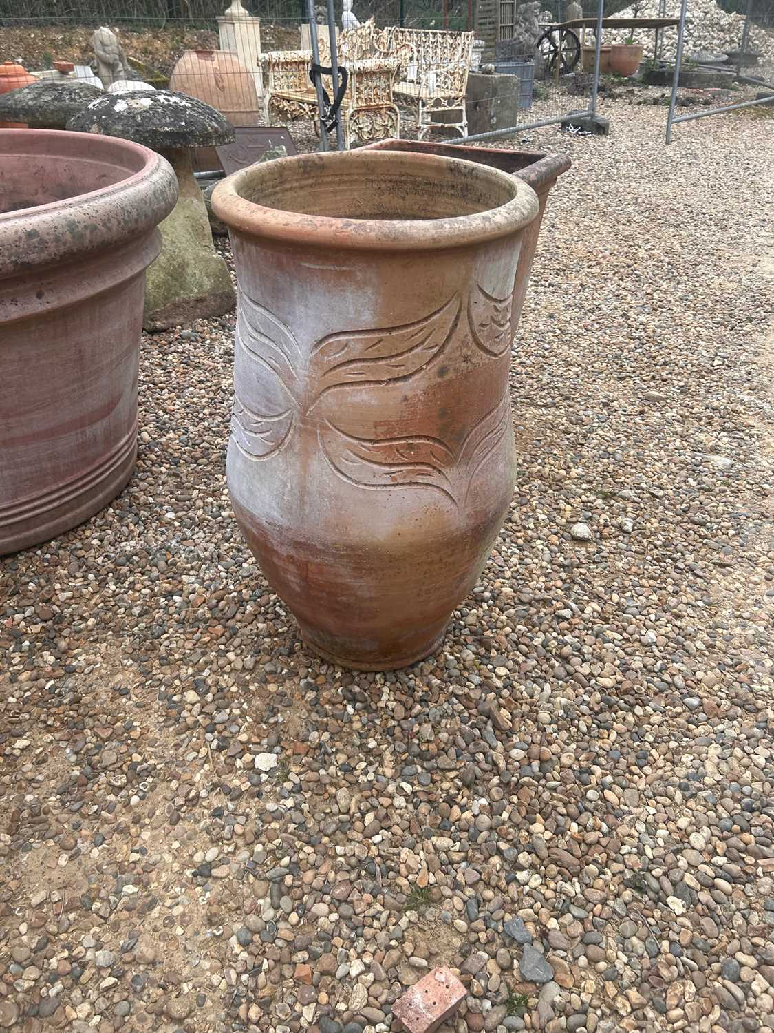 Lot 571 - A large terracotta garden planter