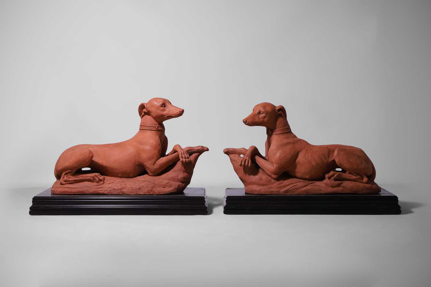Lot 621 - A pair of terracotta whippets