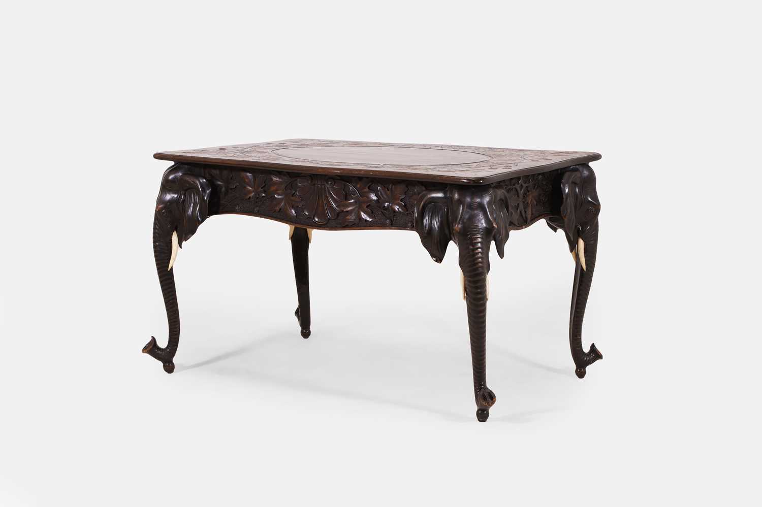 Lot 352 - A Black Forest ivory and carved wood 'elephant' centre table